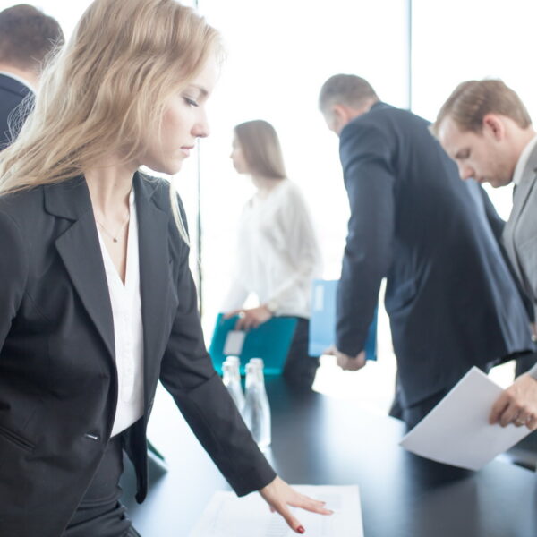 Business people meeting Business people coming and sitting at meeting table